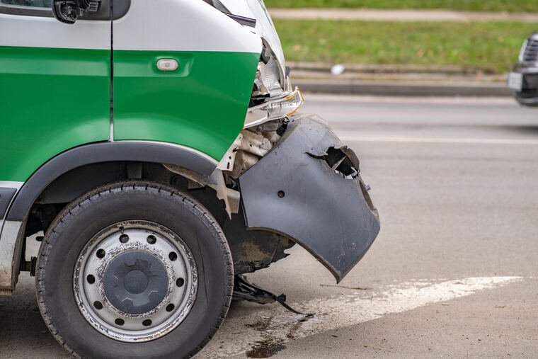 Heavily damaged car after a collision involving a rideshare vehicle