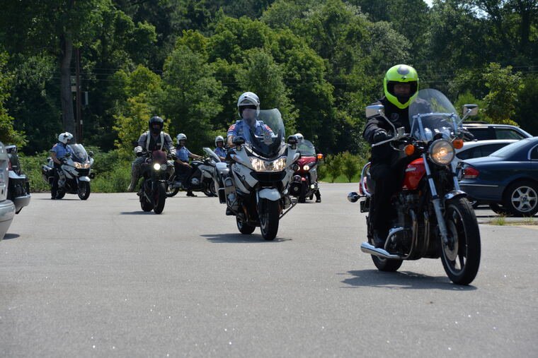 A group of motorcycle riders on the road