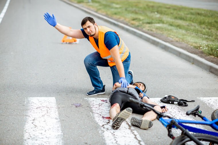 Pedestrian lying in a crosswalk after being struck by a car